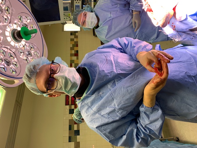 The fellow celebrates his “blind squirrel finds acorn” moment after removal of the distal tibia fragment in one piece.